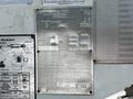 A metal identification plate for a 2012 Freightliner M2 106 with details including model number specifications and inspection report information