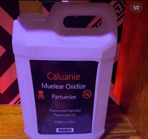 A white plastic container labeled Caluanie Muelear Oxidize with cautions symbols and text indicating it is a harmful thermostat with a 5L capacity