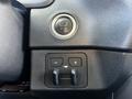 A close-up of the button panel in a 2023 Toyota Tundra with the engine start stop button and controls for heated seats