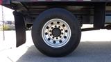 Close-up of a Goodyear tire mounted on a silver wheel of a 2012 International DuraStar 4300 truck