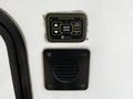 Control panel for auto leveling with buttons for auto level, hitch height, and retract functions