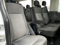 Interior seating of a 2021 Ford Transit with black fabric upholstery showing individual seats arranged in a row