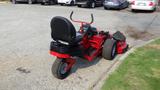 A red 2014 Ferris Mower ISX 800 with a black seat and control panel designed for commercial lawn care use