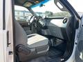 Interior view of a 2011 Ford F-350 Super Duty showing the driver's seat and dashboard with gray cloth upholstery and a spacious cabin design