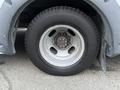 A close-up of a wheel from a 2017 Chevrolet Express showing the tire and rim with several lug nuts visible