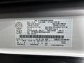 2023 Ford Transit van with a label displaying vehicle specifications and identification details