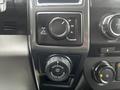 Close-up of the control panel in a 2017 Ford F-150 featuring a four-wheel drive selector dial and a trailer backup control knob