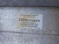 A label indicating the maximum capacity of a lift as 3300 pounds when the load is centered on the load carrying platform