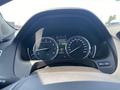 Dashboard of a 2017 Acura TLX showing speedometer and fuel gauge with a digital display indicating average fuel consumption
