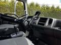 Interior view of a 2020 Hino 338 showing the steering wheel gear shift and dashboard controls