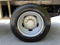 Front wheel of a 2008 Ford F-550 with a Michelin tire mounted on a silver rim