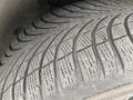 Close-up of a tire tread on a 2009 BMW X5 showcasing the intricate pattern and texture designed for traction and performance