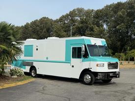 A 2020 Freightliner MT45 truck with a white and teal exterior designed for food service or mobile operations