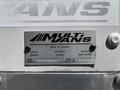A metal identification plate for a 2018 Hino 195 truck displaying the brand name MultiVans along with model and serial number information