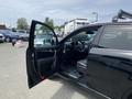 A 2015 Kia Sorento with the driver's side door open showcasing the interior and dashboard area