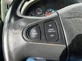 Close-up of the steering wheel controls in a 2008 International 7500 featuring buttons for air horn cruise/throttle and an off switch