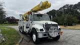 A white 2006 International 7500 truck equipped with a yellow extendable boom mechanism and utility storage compartments on the sides