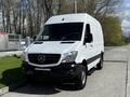 A white 2017 Mercedes-Benz Sprinter van with a sleek design and prominent front grille featuring the Mercedes logo