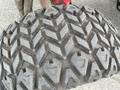 Close-up of a heavy-duty tire tread designed for a Toro Groundsmaster 5910 showcasing a deep, aggressive pattern for traction on various surfaces