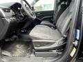 Interior of a 2016 Chevrolet Tahoe featuring black fabric seats and a dashboard with controls and a steering wheel