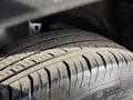 Close-up of a tire on a 2020 Ford Escape showcasing the tread pattern and sidewall features