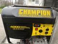 A 2006 Ford F-450 truck with a visible yellow and black generator labeled Champion Global Power Equipment featuring specifications for starting watts and rated watts