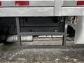 A black metal frame structure attached to the rear of a 2008 Ford F-450 SD with visible bolts and pipes underneath