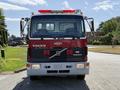 Front view of a red 1994 Volvo FE 42 truck featuring a prominent Volvo logo and emergency lights on the roof