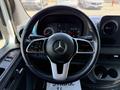 Steering wheel of a 2019 Mercedes-Benz Sprinter with the Mercedes logo and control buttons visible on the spokes