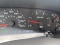 Dashboard of a 2003 Ford F-450 SD showing speedometer tachometer and other gauges