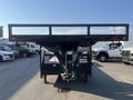 A 2020 Load Trail 28 Foot Gooseneck trailer with a flatbed design and a gooseneck hitch visible from the rear