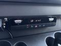 Control panel of a 2019 Mercedes-Benz Sprinter featuring temperature controls AC settings and various buttons for vehicle functions
