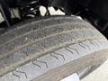 Close-up of a tire on a 2020 Ford F-550 showing detailed tread pattern and wear on the surface