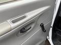 Interior door handle and window crank of a 2007 Ford E-350 van