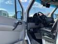 Interior view of a 2010 Mercedes-Benz Sprinter showing the driver's seat steering wheel and dashboard