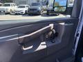 The image shows the interior door handle and panel of a 2019 GMC Savana with controls for locks and windows