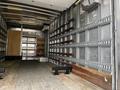 A 2018 Hino 195 truck interior featuring metal walls with wooden beams and a wooden floor indicating a cargo space