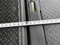 A measuring tape laid across a textured black surface showing measurements in inches from 24 to 288