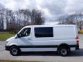 A white 2016 Mercedes-Benz Sprinter van parked on a paved surface showing its side profile with no visible passengers or cargo inside