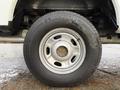 Close-up of a silver wheel and tire from a 2017 Ford F-350 SD showing the Michelin tire tread and metal rim design