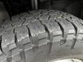 Close-up of a worn tire tread on a 2018 RAM Promaster showcasing deep grooves and rough surface texture