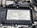 A close-up view of an engine's information plate displaying engine specifications and important details for a 2018 Hino 195 diesel engine