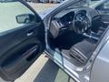 2017 Acura TLX interior with open driver's door showing steering wheel dashboard and seats in black upholstery