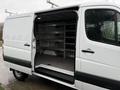 2017 Mercedes-Benz Sprinter van with open side door revealing organized shelving inside