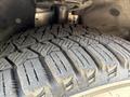 Close-up of a tire with tread patterns showcasing deep grooves and detailing on a 2021 Ford Transit Connect