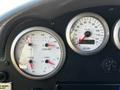 Dashboard of a 2006 Emergency One Fire Truck showing gauges for oil, coolant, transmission, voltage and speed