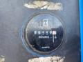 A close-up of a gauge displaying hours of operation on a 1997 Genie S-65 4X4 indicating 610 hours with a quartz label