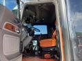 Interior view of a 2009 Peterbilt Highway truck highlighting the driver's seat steering wheel and gear shift