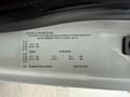 A label on a vehicle door frame showing specifications for a 2016 International 7400 including weight capacity and manufacturing details