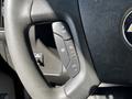 Close-up of the steering wheel controls of a 2019 Chevrolet Express showing buttons for cruise control settings
